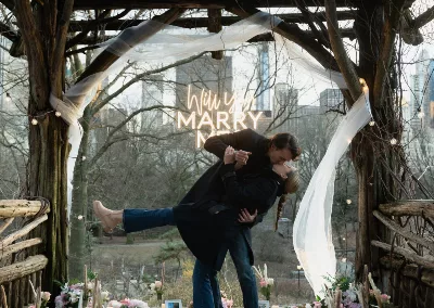 surprise marriage proposal in central park by enchanting engagements